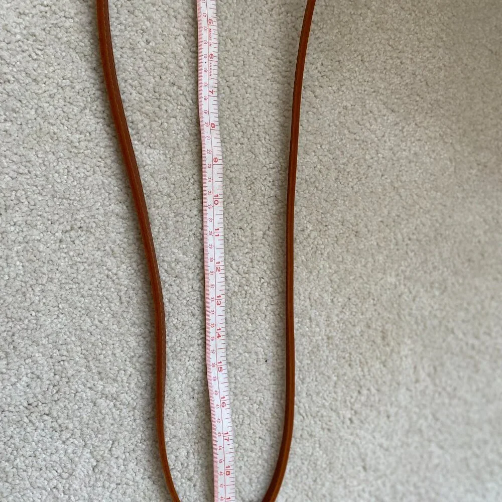 Round solid rattan woven crossbody purse cloth lined, leather accents.
